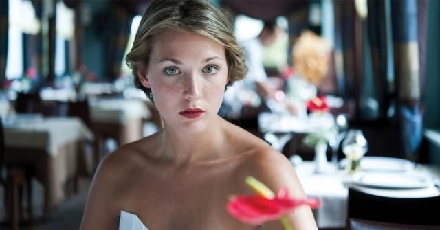 Elegantly dressed woman guest in a stylish restaurant setting